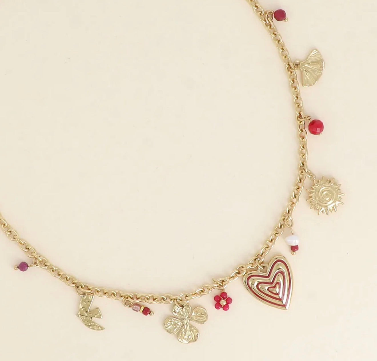 Collier soleil, coeur, trèfle et perles