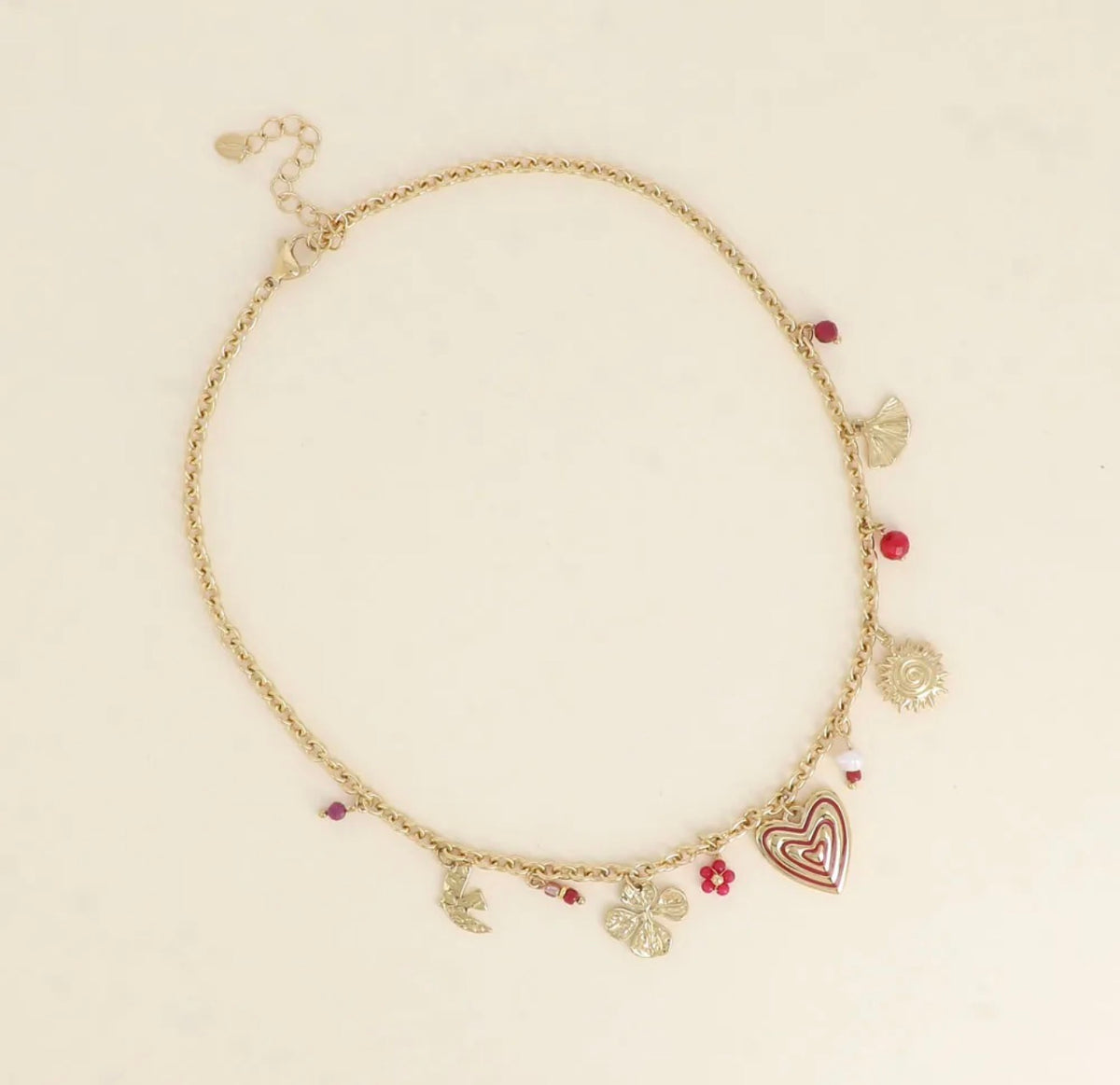 Collier soleil, coeur, trèfle et perles
