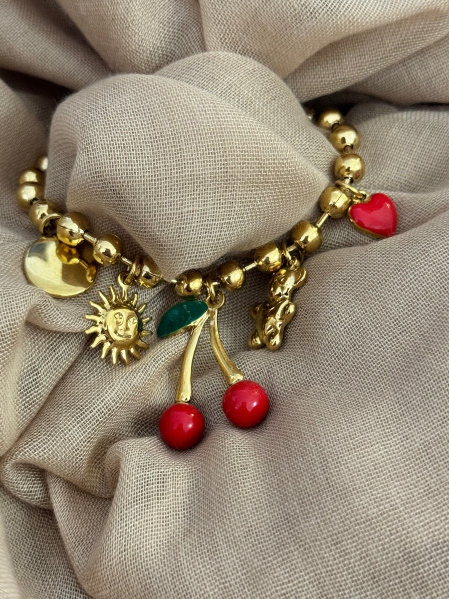 Bracelet élastique en acier inoxydable doré – Pendentifs soleil, cerise, cœur et nounours - C MON DRESSING